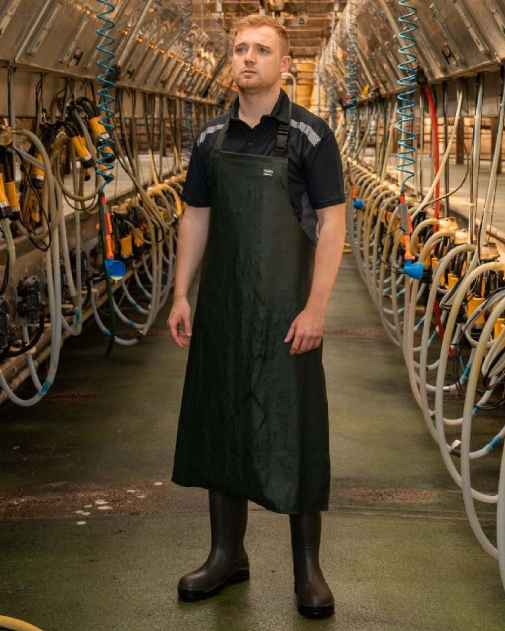Green Coloured Xpert Swampmaster No-Sweat Stormgear Waterproof Dairy Apron on Factory Background
