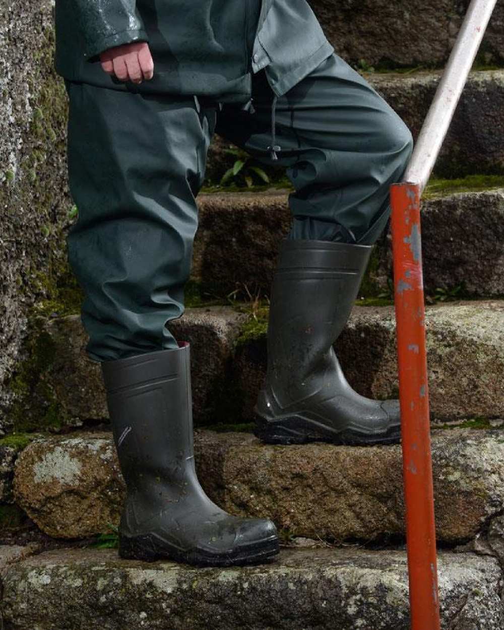 Green Coloured Xpert Swampmaster No-Sweat Stormgear Waterproof Trousers on Outdoor Background
