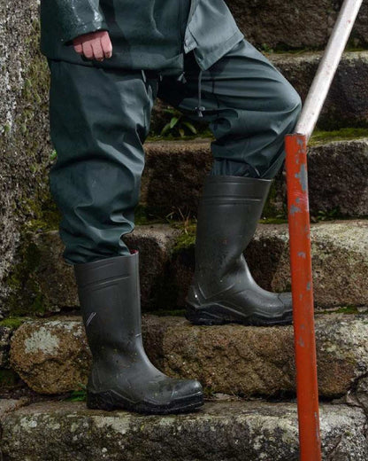 Green Coloured Xpert Swampmaster No-Sweat Stormgear Waterproof Trousers on Outdoor Background
