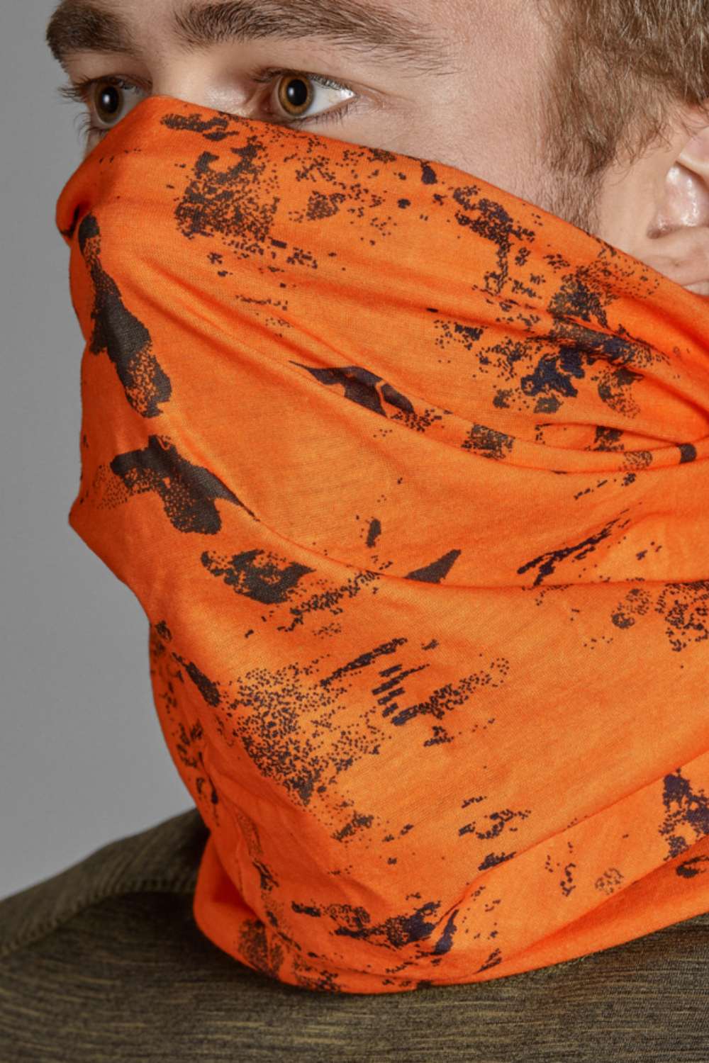 Seeland Neck Gaiter 2 Pack in Orange Blaze worn as a face mask 