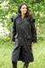 woman wearing Long Waxed Cotton Coat by Bronte Outdoor. #colour_green
