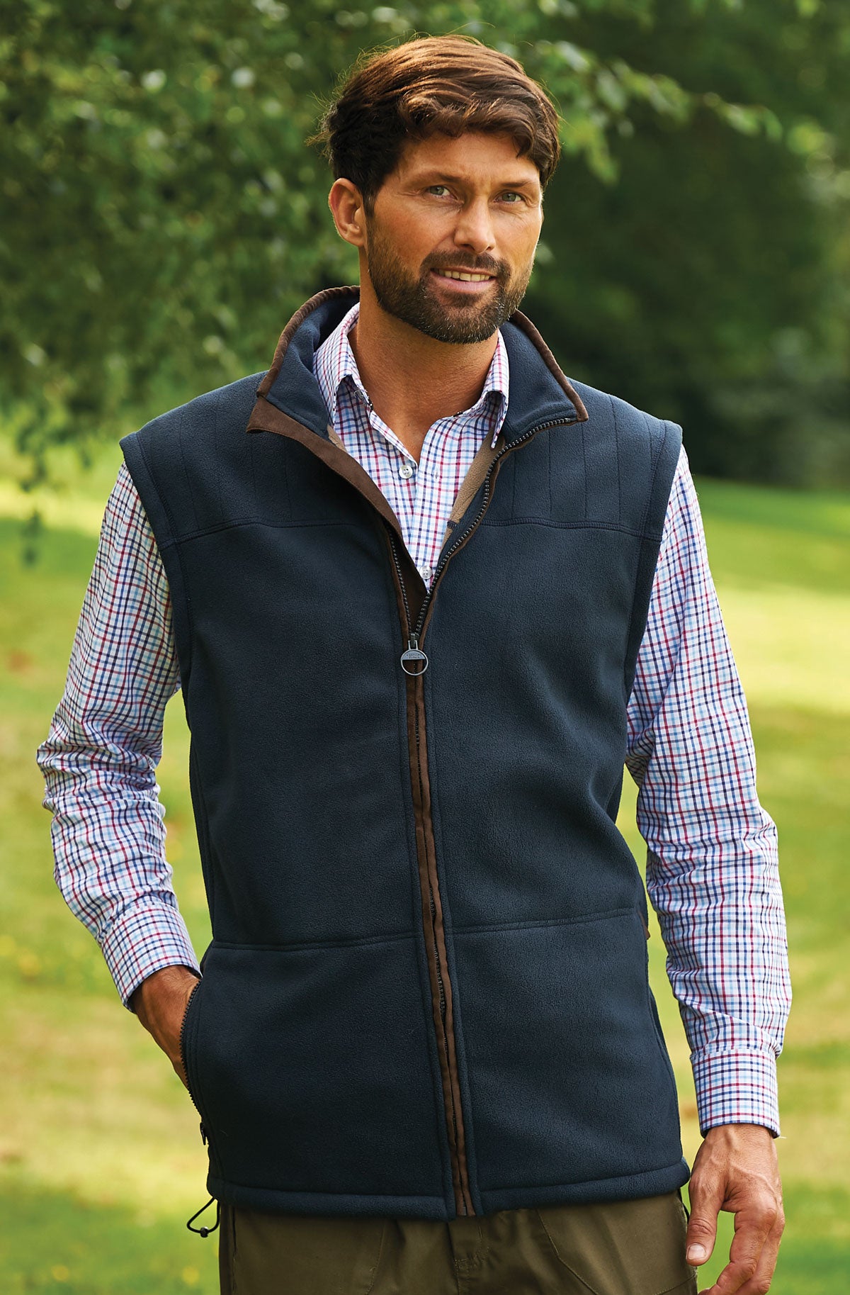 man in  a micro fleece lined gilet in navy by champion  