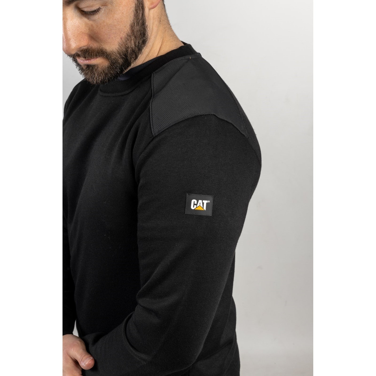 Caterpillar Essentials Crewneck Sweatshirt in Black. Sleeve 