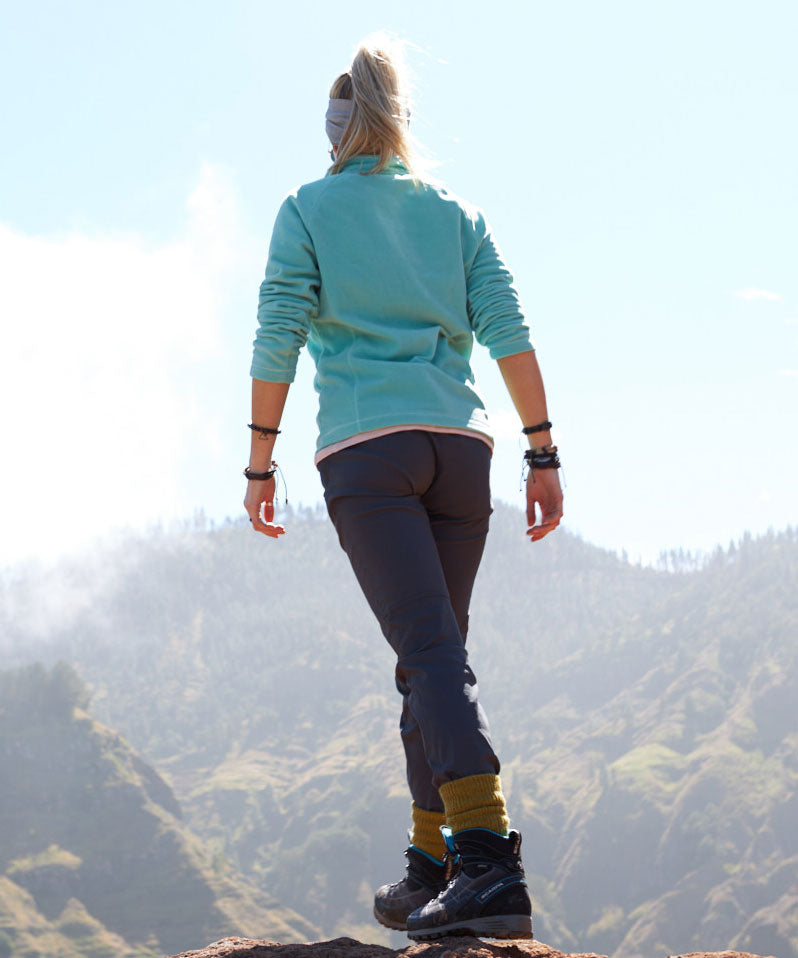 Woman on top of peak