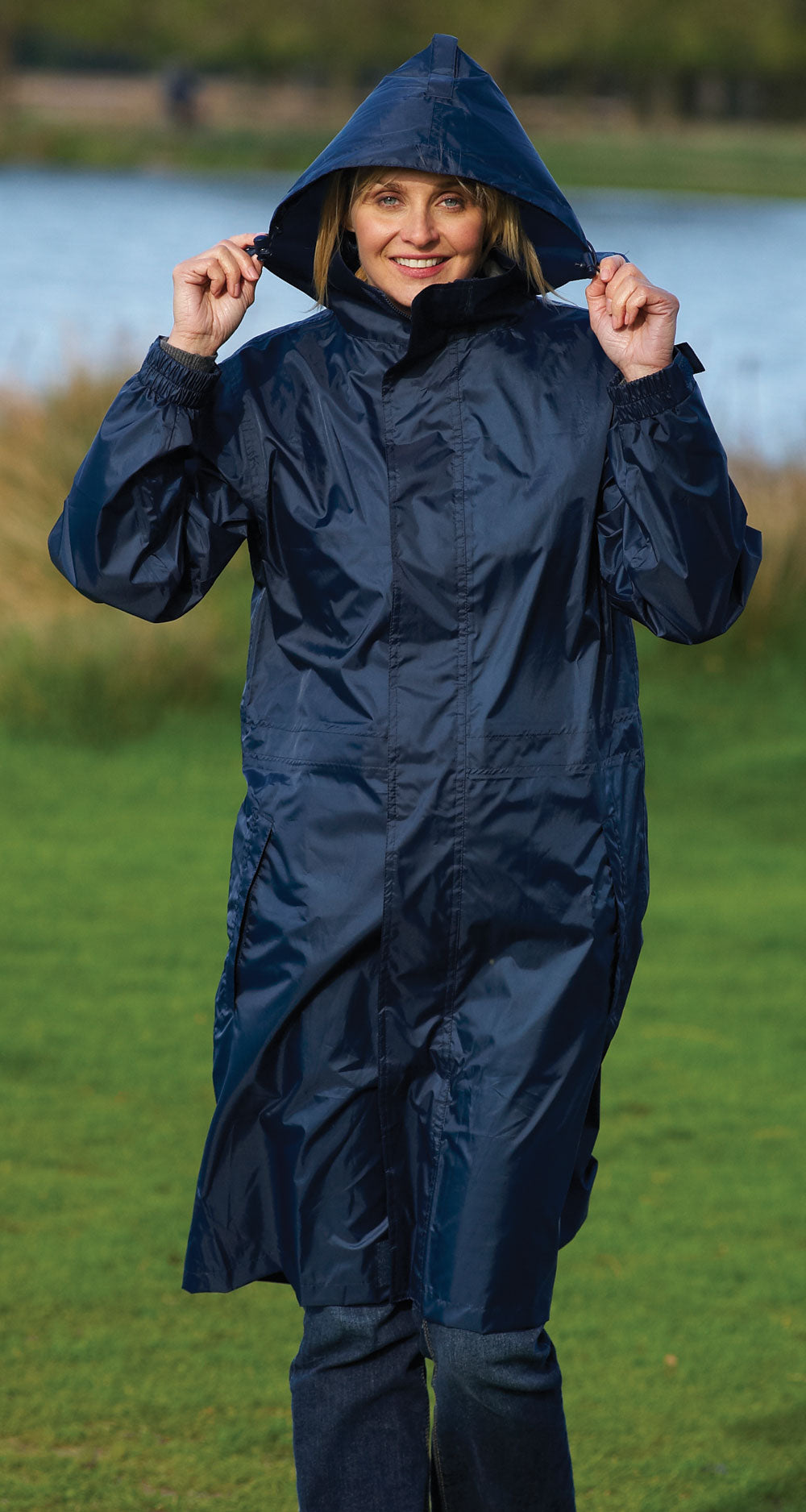 Champion Storm waterproof raincoat  with hood worn by woman.